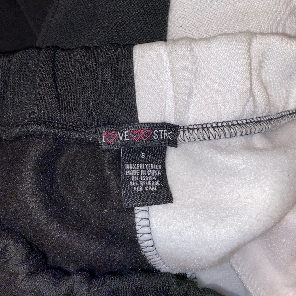 Black && white multi colored sweatpants, size small.